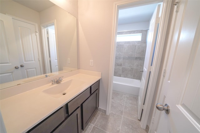 full bathroom with tile patterned flooring, washtub / shower combination, and vanity