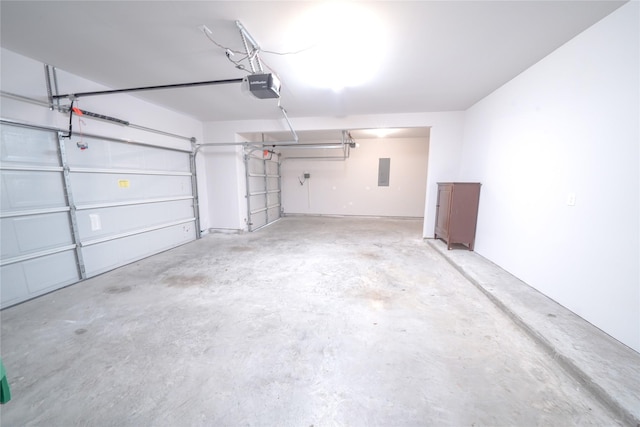 garage with electric panel and a garage door opener