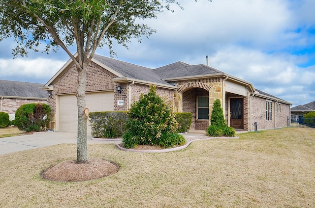 single story home featuring a garage and a front yard