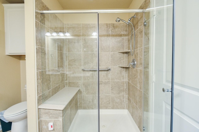 bathroom with an enclosed shower and toilet