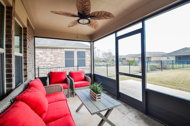 sunroom with ceiling fan