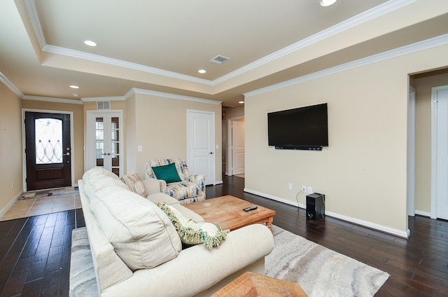 living room with french doors, ornamental molding, dark hardwood / wood-style floors, and a tray ceiling