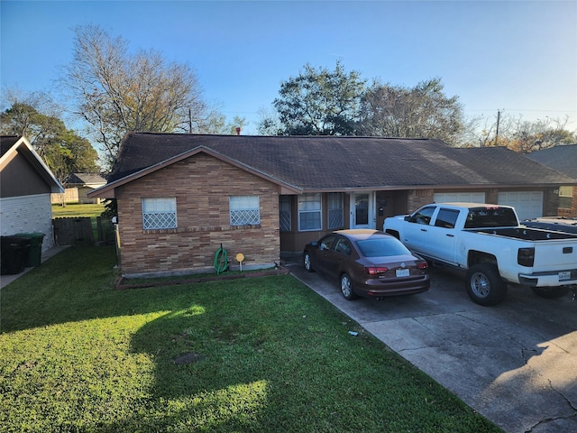 ranch-style house with a garage and a front yard