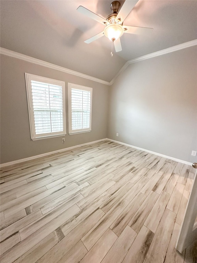 empty room with vaulted ceiling, ornamental molding, light hardwood / wood-style floors, and ceiling fan