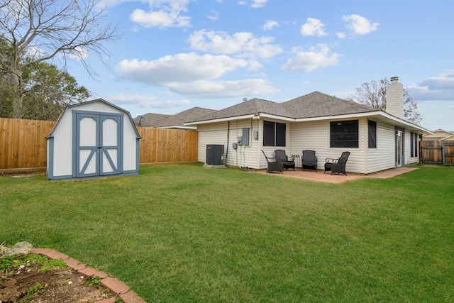 back of property with central AC, a shed, an outdoor structure, and a fenced backyard