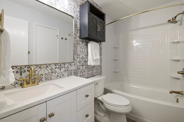 full bath with bathtub / shower combination, toilet, a textured ceiling, vanity, and wallpapered walls