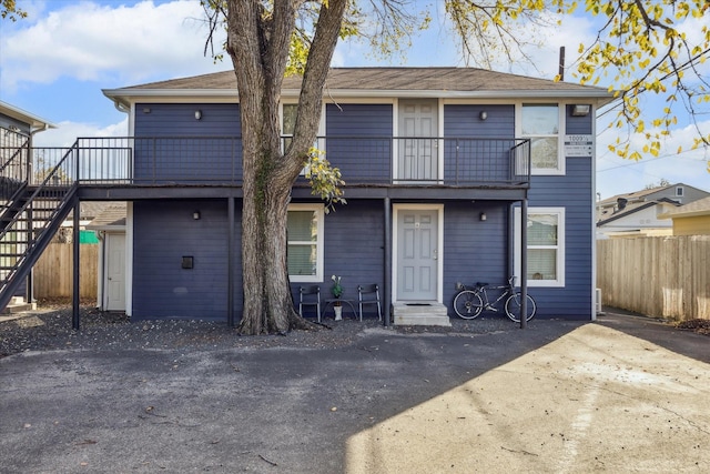 front of property featuring a balcony