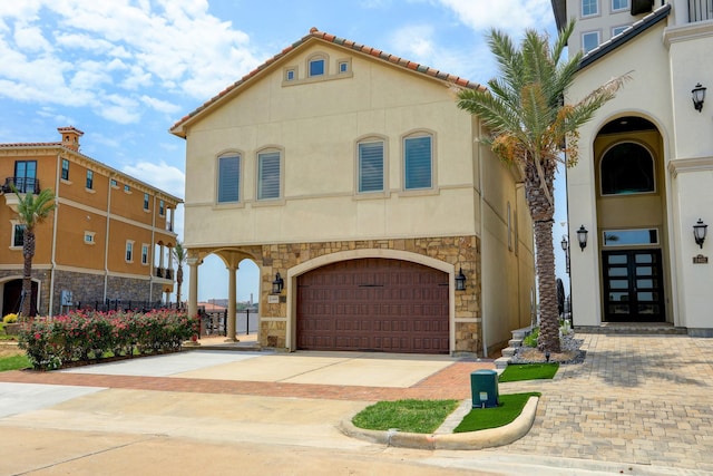 mediterranean / spanish house featuring a garage