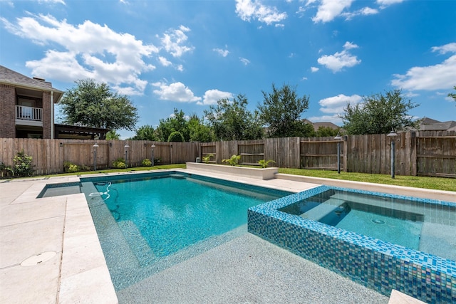 view of pool featuring an in ground hot tub