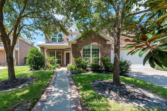 view of front facade with a garage and a front yard