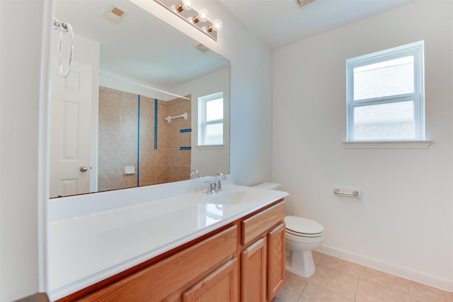 bathroom featuring tile patterned flooring, vanity, and toilet