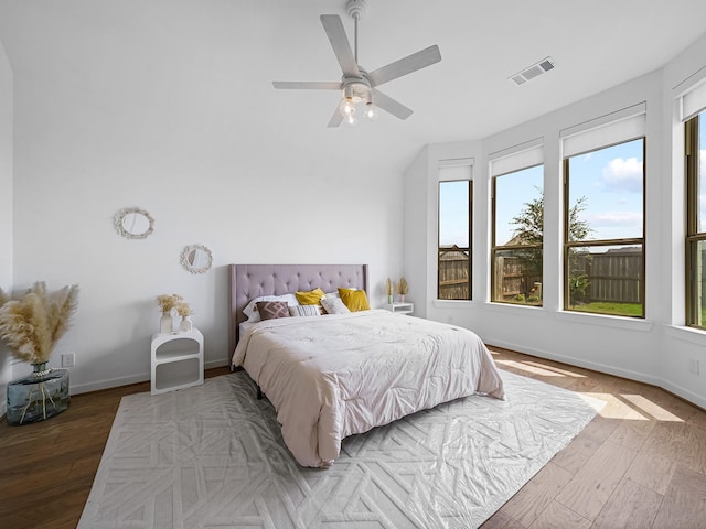 bedroom with dark wood-type flooring and ceiling fan