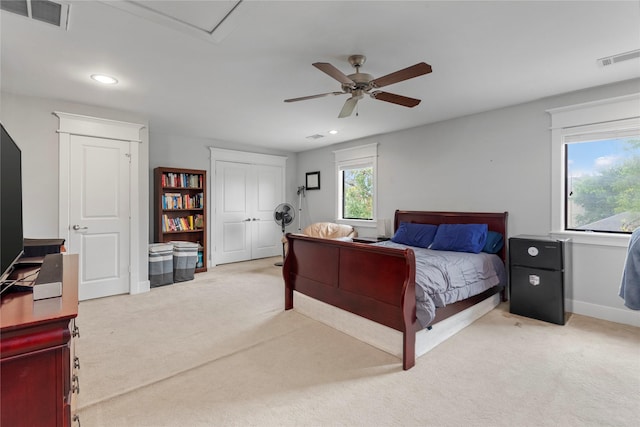 bedroom with ceiling fan and light colored carpet