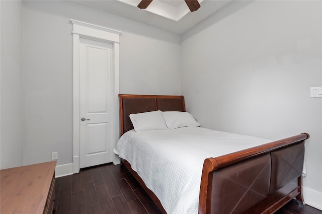 bedroom with ceiling fan and dark hardwood / wood-style flooring