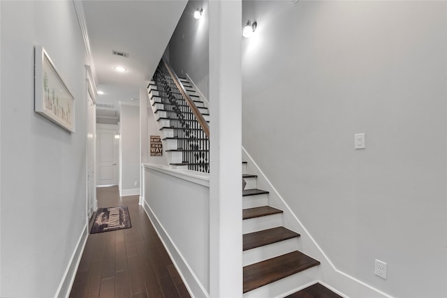 staircase with wood-type flooring