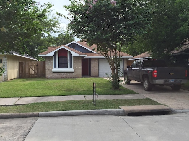 view of front facade with a garage and a front lawn