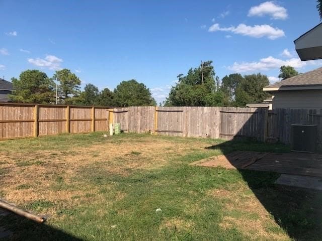 view of yard with central AC unit