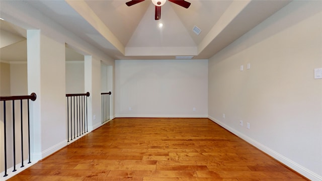 unfurnished room featuring ceiling fan, vaulted ceiling, and light hardwood / wood-style floors