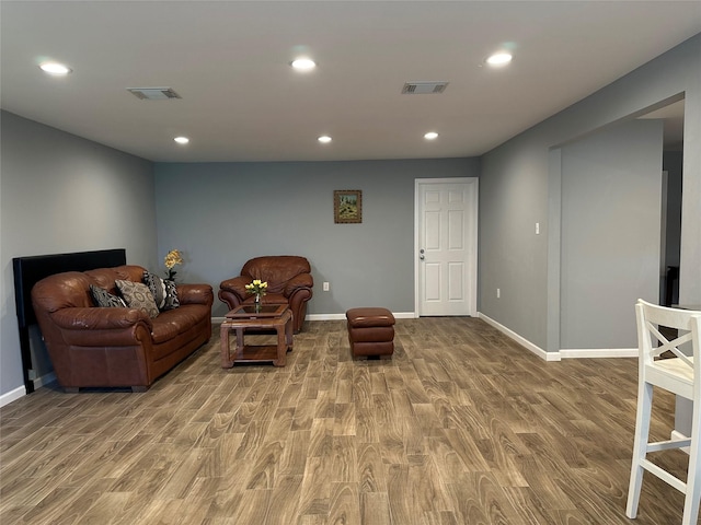 sitting room featuring recessed lighting, visible vents, baseboards, and wood finished floors