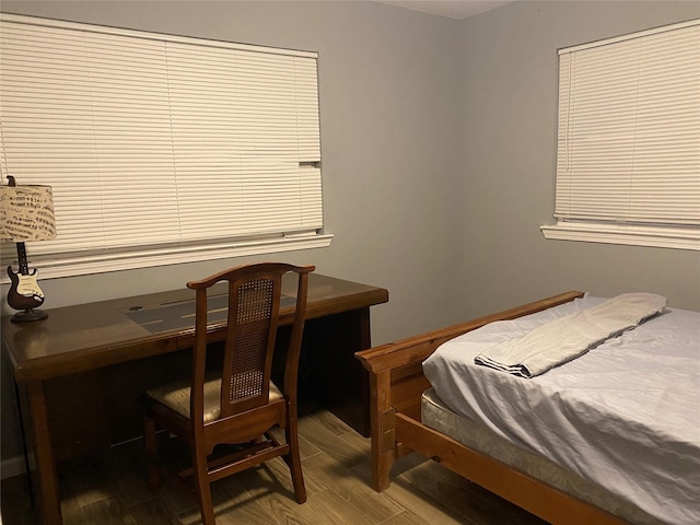 bedroom with wood finished floors