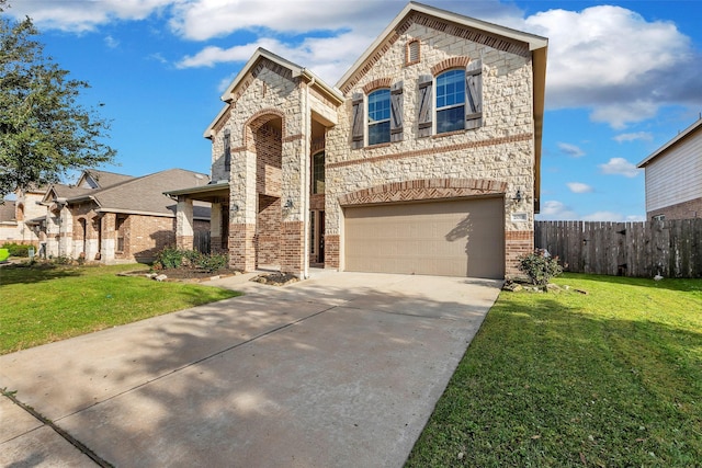 view of front of property with a garage and a front yard