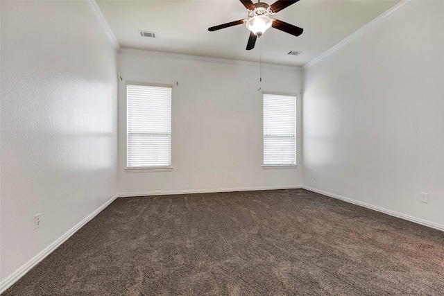 carpeted spare room featuring crown molding and ceiling fan