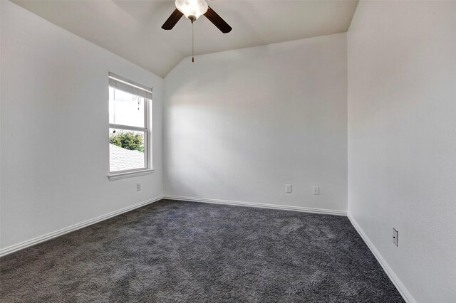 carpeted spare room with ceiling fan and lofted ceiling