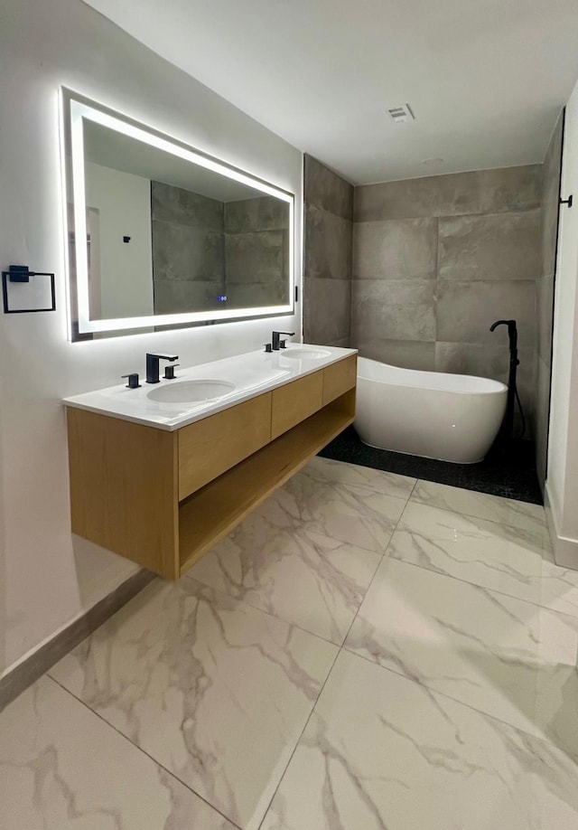 bathroom featuring vanity and a bathing tub