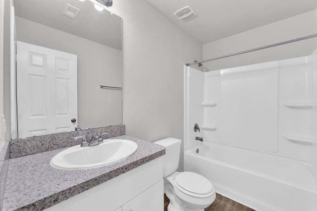 full bathroom with vanity, toilet, tub / shower combination, and wood-type flooring