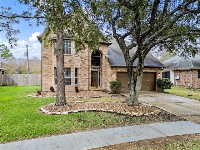 view of front facade with a garage and a front lawn