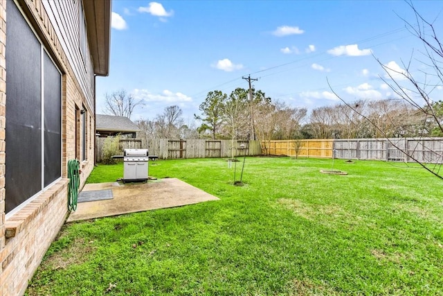 view of yard featuring a patio area and a fenced backyard