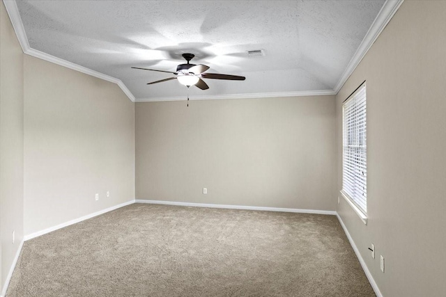 empty room featuring a textured ceiling, a ceiling fan, crown molding, and carpet flooring