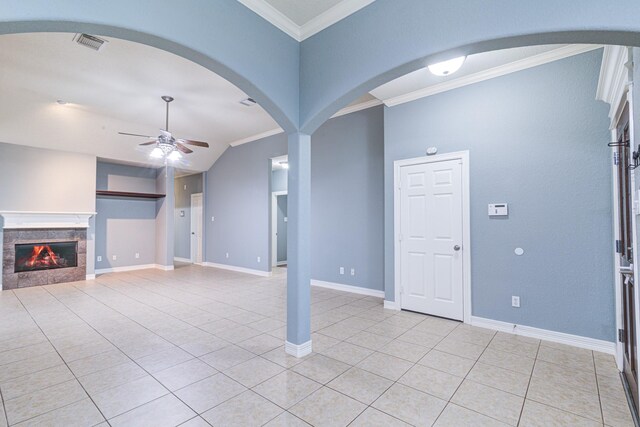 unfurnished living room featuring crown molding, a fireplace, light tile patterned floors, visible vents, and a ceiling fan