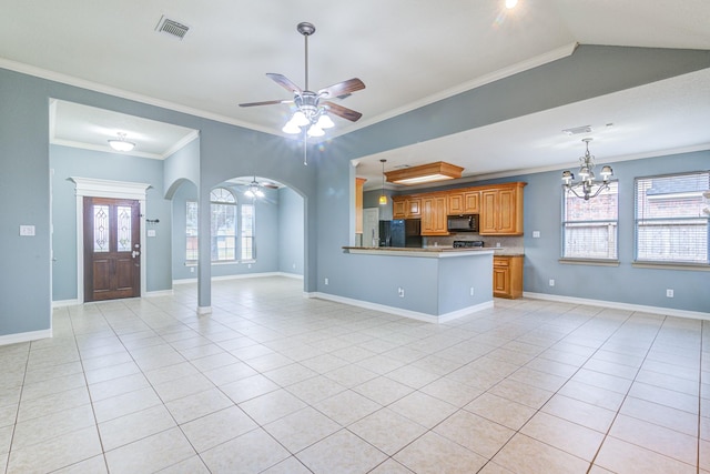 kitchen with visible vents, arched walkways, open floor plan, a peninsula, and black appliances