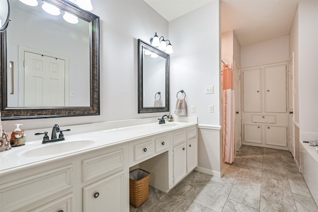 bathroom with vanity and a bathtub