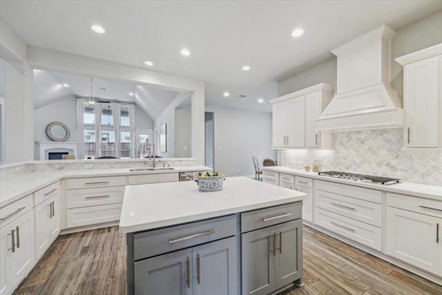 kitchen featuring gray cabinetry, white cabinets, sink, and stainless steel gas stovetop