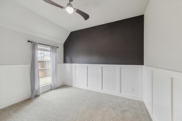 unfurnished room with light carpet, lofted ceiling, and ceiling fan