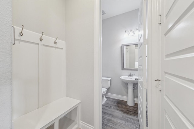 interior space with dark hardwood / wood-style floors and sink