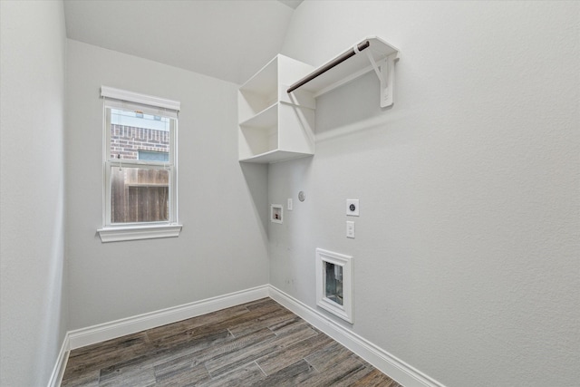 clothes washing area with dark wood-type flooring, hookup for a gas dryer, hookup for a washing machine, and electric dryer hookup