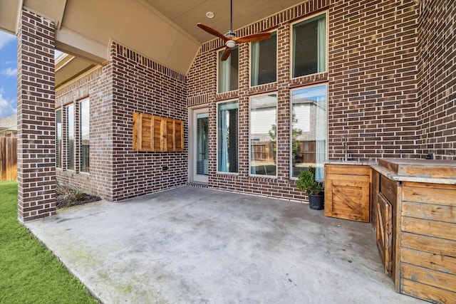 view of patio featuring ceiling fan