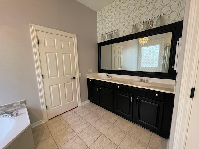 bathroom with tile patterned floors, a sink, a bath, and double vanity