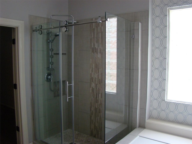 full bath featuring a shower stall