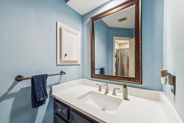 bathroom with visible vents and vanity