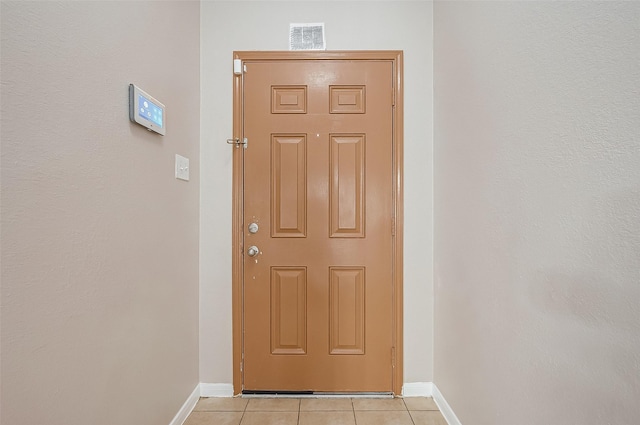 entryway featuring light tile patterned flooring