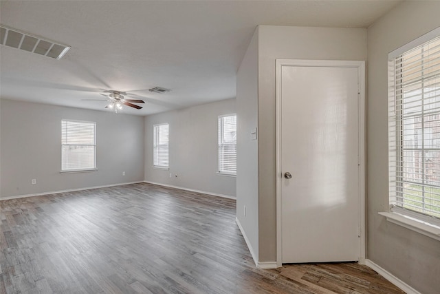 foyer with hardwood / wood-style floors and ceiling fan