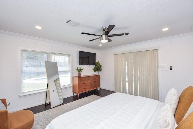 bedroom featuring crown molding, ceiling fan, and dark wood-type flooring