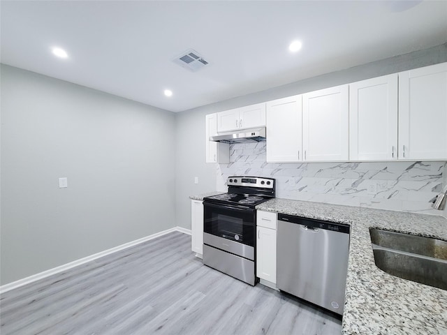 kitchen featuring sink, appliances with stainless steel finishes, light stone counters, tasteful backsplash, and white cabinets