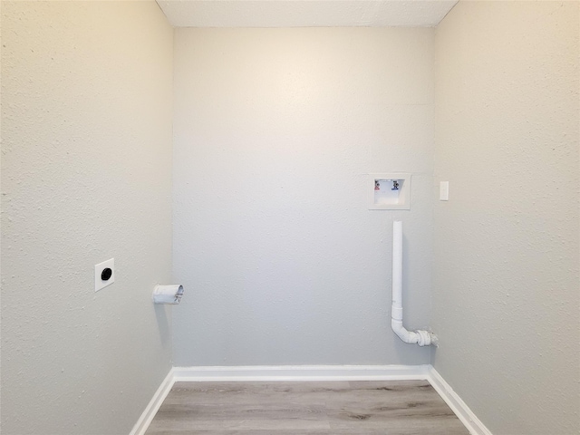 laundry room with electric dryer hookup, washer hookup, and hardwood / wood-style floors