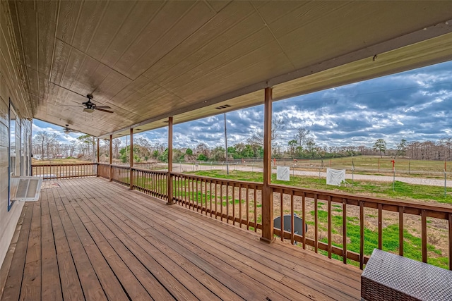 deck featuring a rural view and ceiling fan