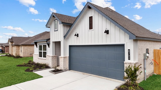 view of front of home featuring a garage and a front lawn